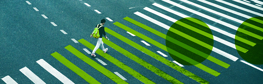 Person crossing street, with 7 crosswalk stripes highlighted, representing the 7 steps to data-informed decision making